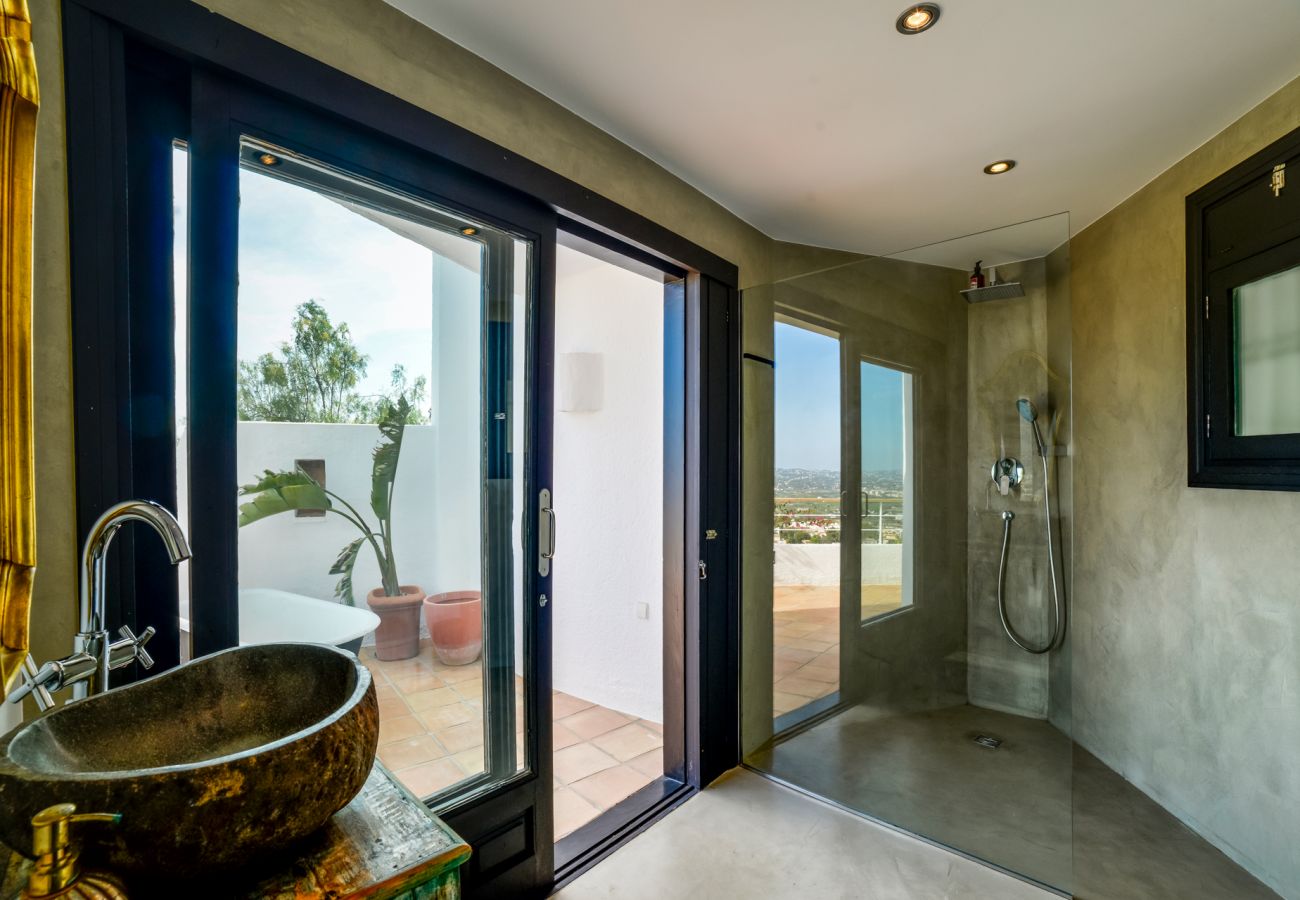 bathroom with shower, garden view and access to terrace 