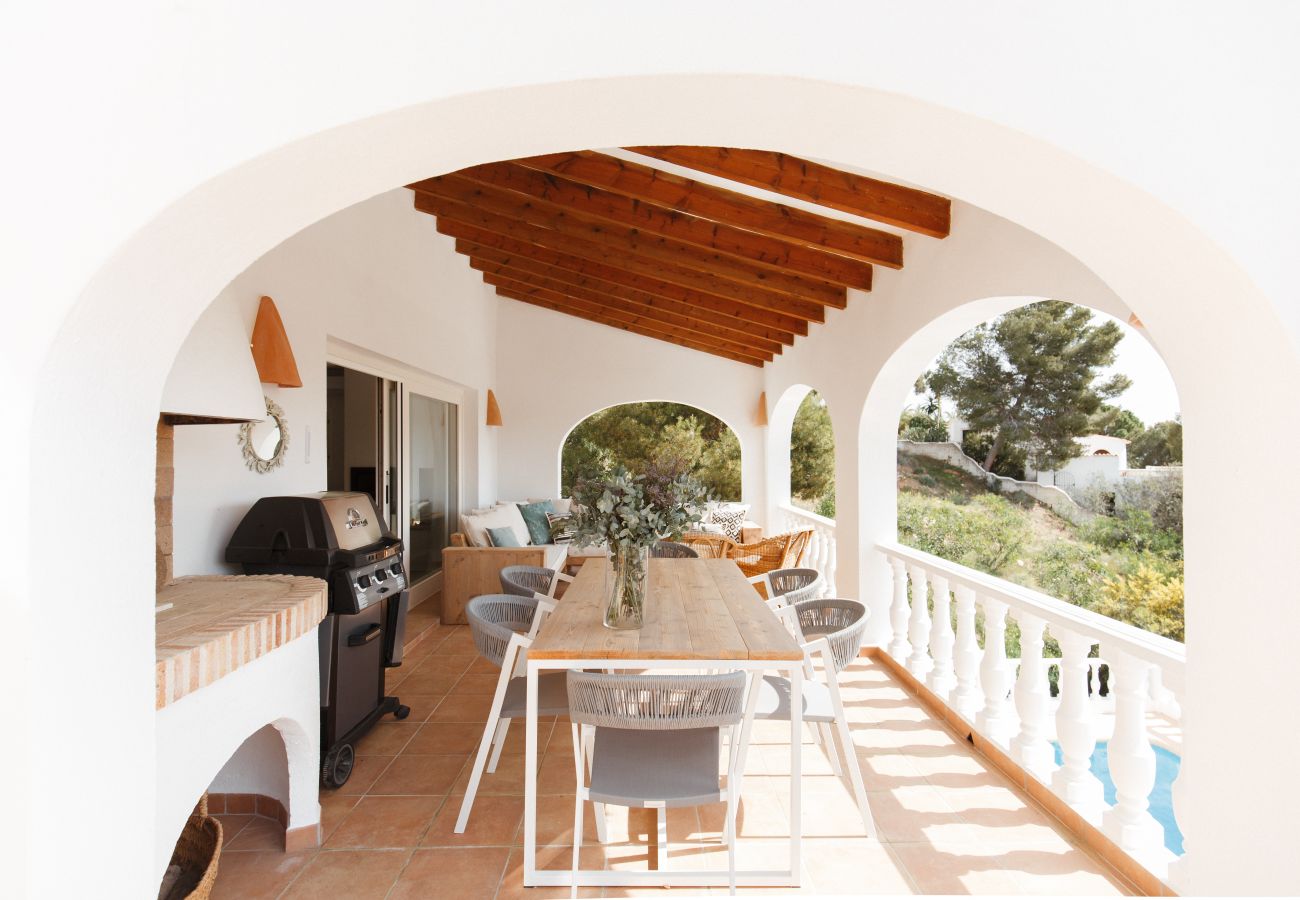 terrace with dining area and barbecue, views to sea